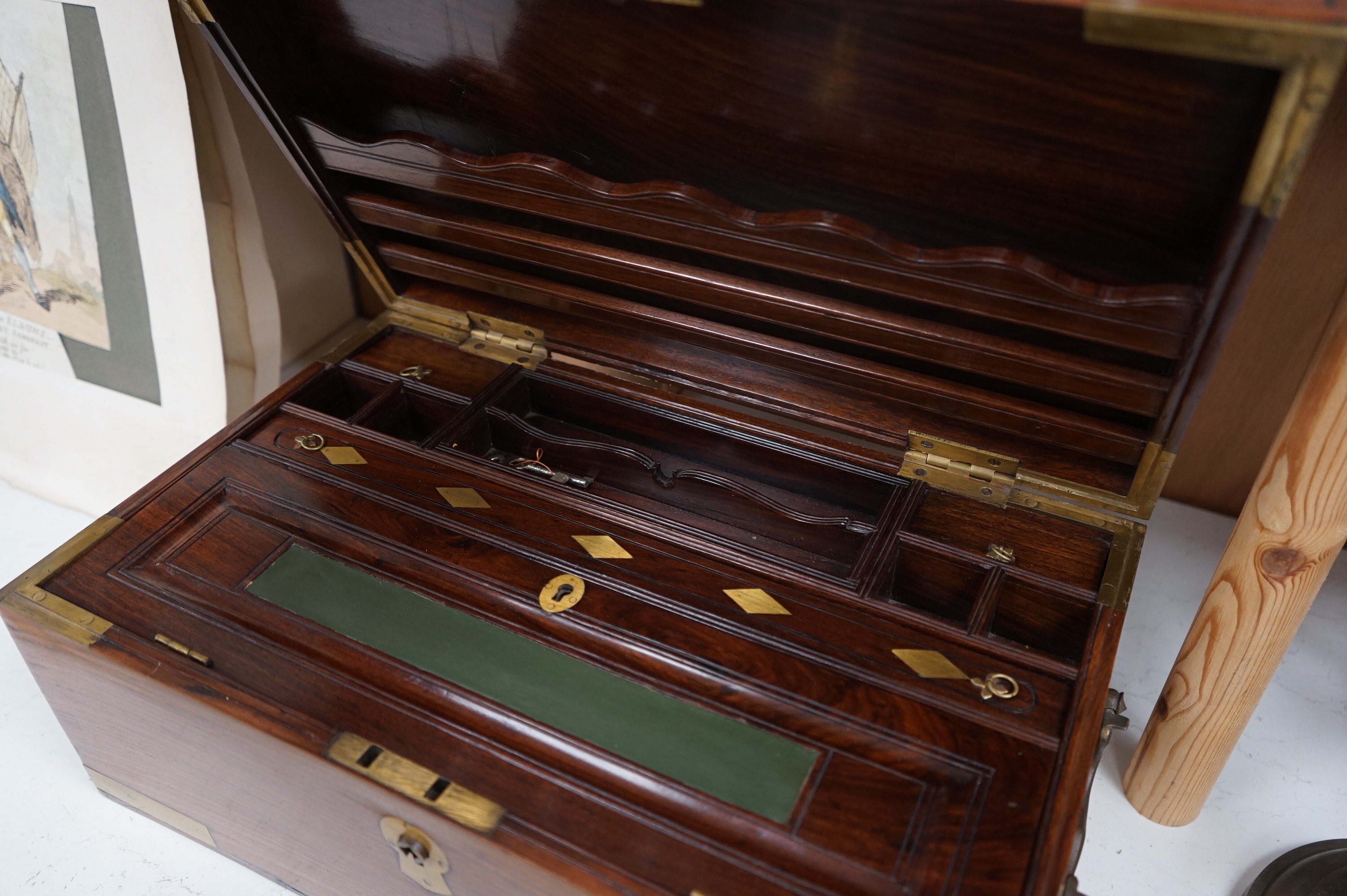 A 1920’s Anglo Indian brass mounted rosewood chest with fitted interior and key, 48cm wide. Condition - fair/good